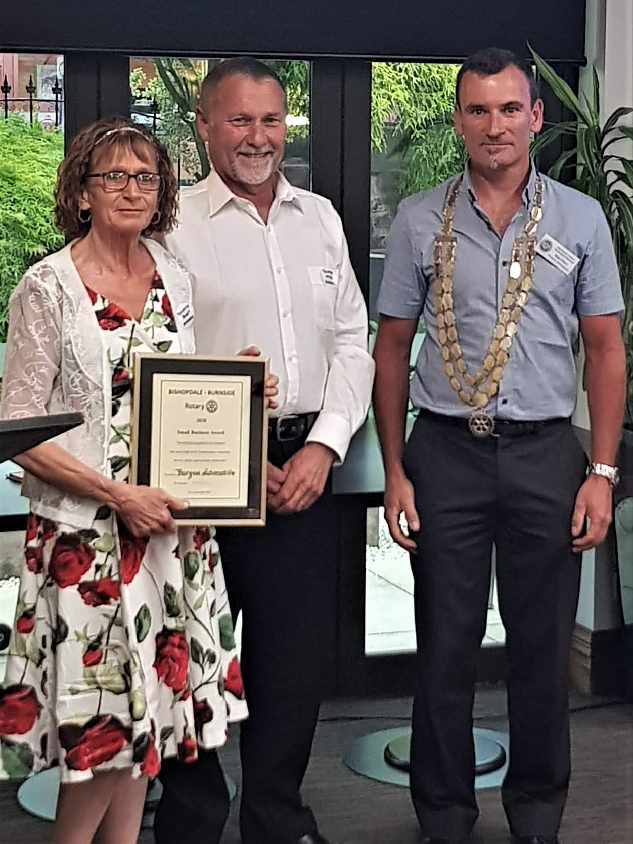 Small Business Excellance Award presented By Club President Matt Ellery to Wayne and Janet Burgess of Burgess Automotive